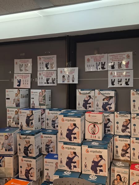 Branded kids and babies fair with discounts up to 90% off selected items including Ergobaby carriers from HK$199, high chairs at 90% off from HK$299, and gift bags.
