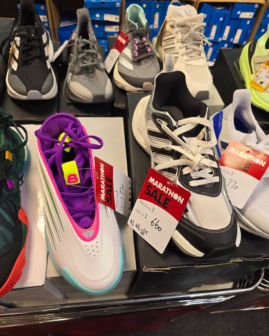 Harbour City Bazaar — Marathon sportswear mega sale with tiered discounts: selected items at fixed prices, buy 2 get 10% off or buy 3 get 20% off on red-tagged items.