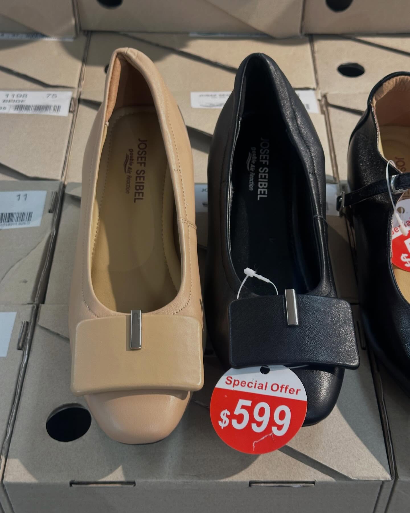 Times Square Bazaar — Sports and leisure wear sale with selected items up to 60% off. Featured items include women's clothing from $699, umbrellas at $139, scarves from 40% off, and men's/women's shoes from $299.