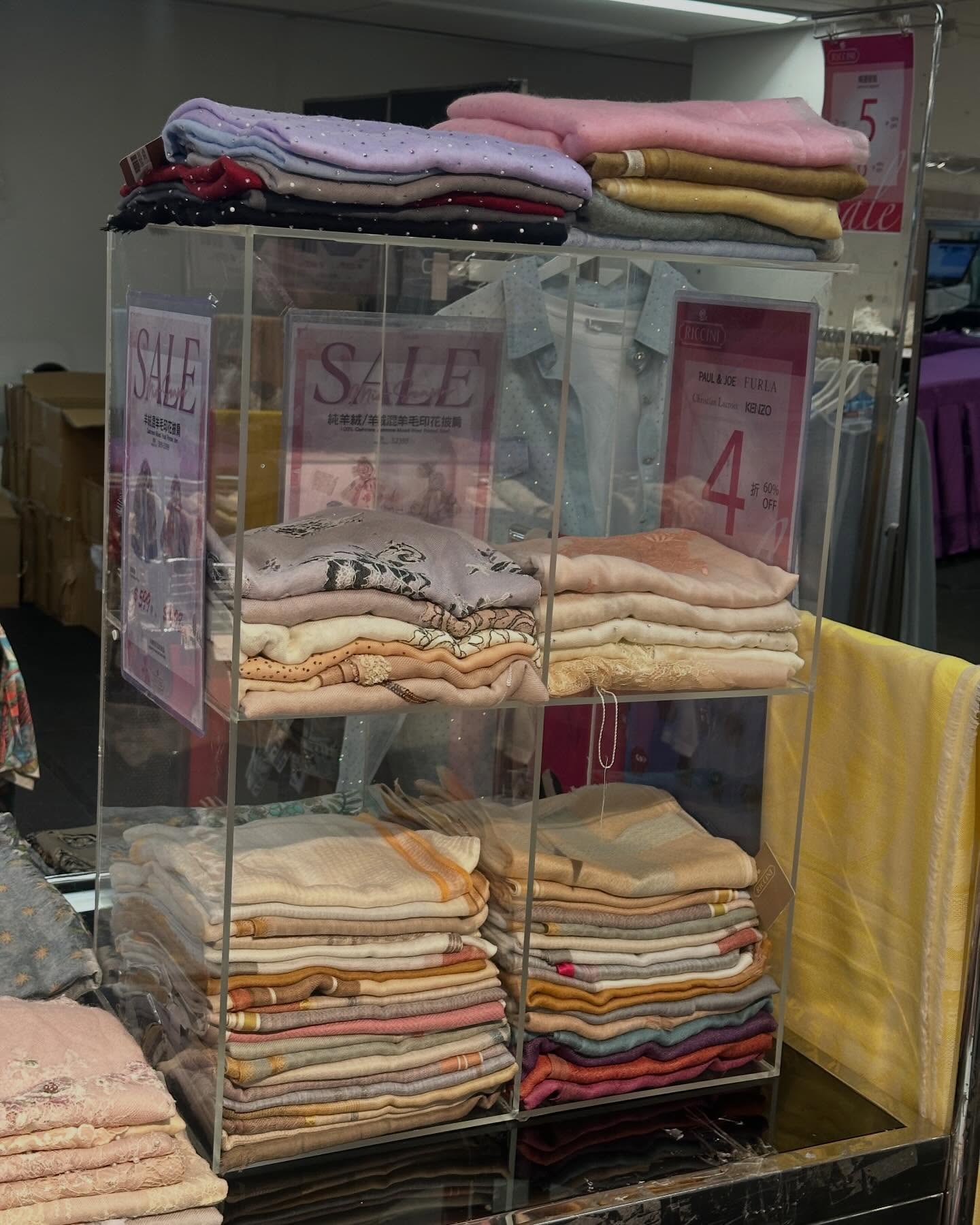 Times Square Bazaar — Sports and leisure wear sale with selected items up to 60% off. Featured items include women's clothing from $699, umbrellas at $139, scarves from 40% off, and men's/women's shoes from $299.