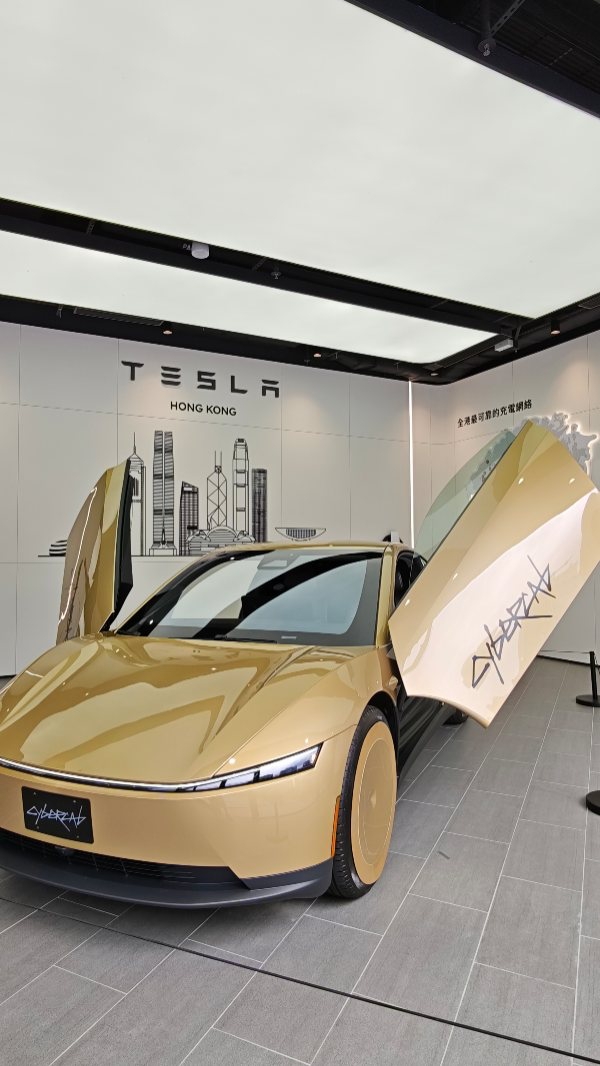 Free commemorative sticker pack with guided tour completion at Tesla Cybercab exhibition.