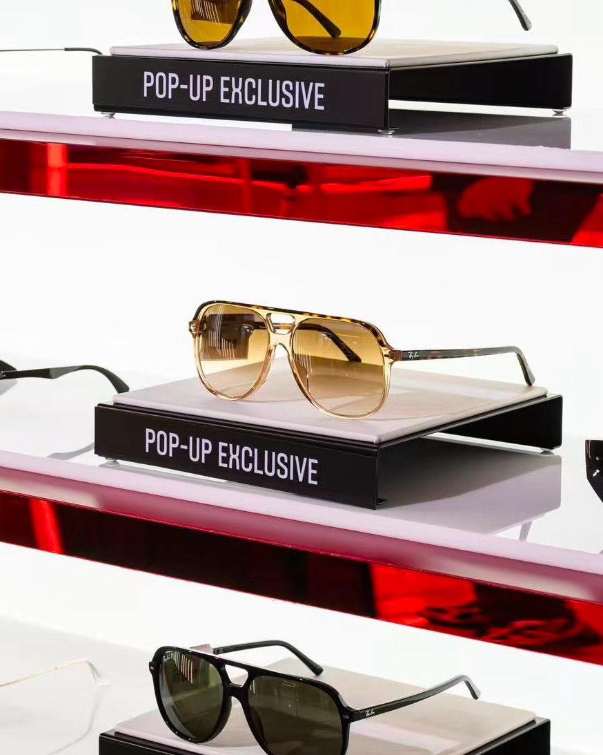 lenscrafters — Pop-up store with AI photo booth, free glasses-case engraving with purchase, and DIY bracelet workshop with select eyewear purchase.
