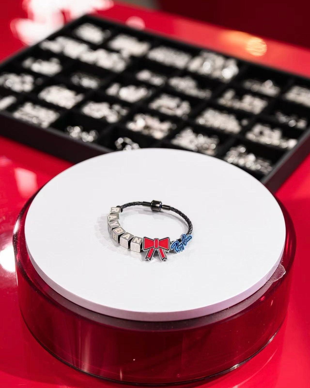 lenscrafters — Pop-up store with AI photo booth, free glasses-case engraving with purchase, and DIY bracelet workshop with select eyewear purchase.