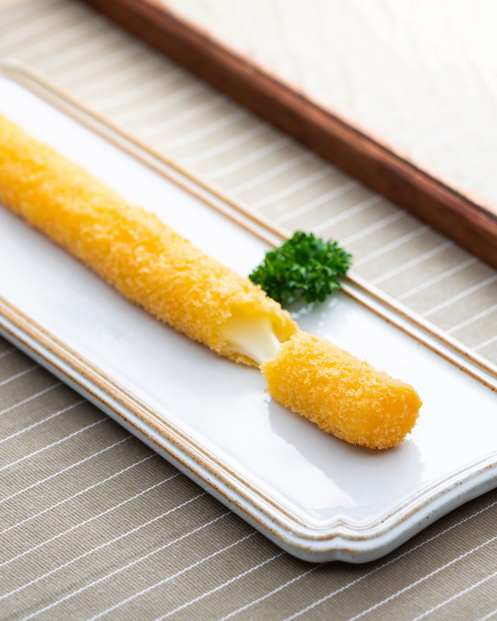 New limited-time autumn menu item: extra-long fried cheese stick with truffle flavor for HK$19.