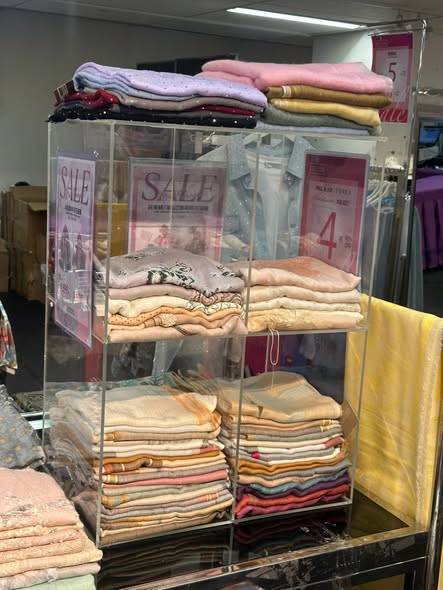 Times Square Bazaar — Sports and leisure wear flash sale with multiple brands offering discounts up to 50% off, tiered discounts on select items, and half-price deals on swimwear and luggage.